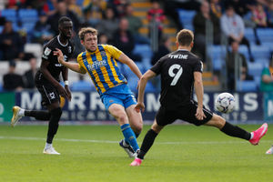 Matthew Pennington of Shrewsbury Town and Scott Twine of MK Dons (AMA)