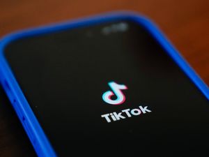 TikTok logo on a phone