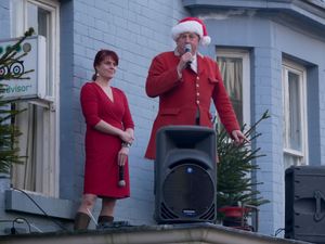 Robert Jones, senior joint master of the Radnor and West Herefordshire addresses the crowds watched by Burton Hotel owner Jana Hyde.