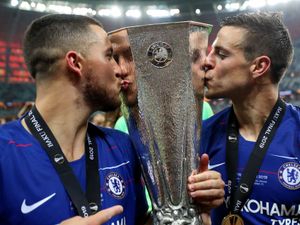 Chelsea’s Eden Hazard (left) and Cesar Azpilicueta kiss the Europa League trophy