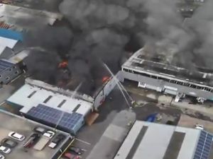 Supporting image for story: Reason given for factory fire which led to huge smoke column billowing into sky