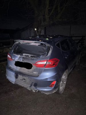 The vehicle crashed into a hedge and a farm building. Picture: Oswestry and Ellesmere Police