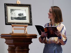 Hugo Burge Foundation chief executive officer Lucy Brown with the etching by Rembrandt