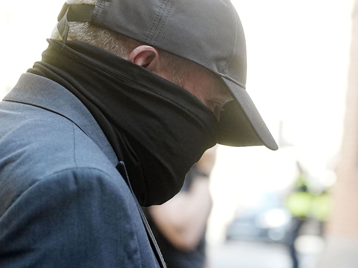 Funeral director appears in court charged over human remains found at premises