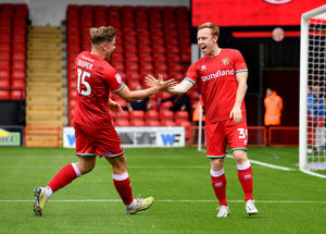 Danny Johnson celebrates his goal with Freddie Draper