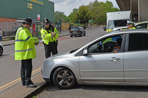 Police doing a stop and search of cars for weapons as part of a national campaign to end knife crime.
