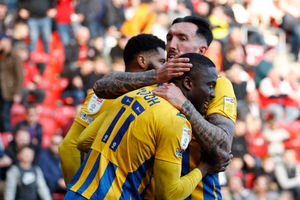 Dan Udoh of Shrewsbury Town celebrates with his team mates after scoring a goal to make it 0-1 (AMA)