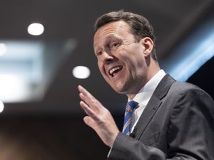 Russell Findlay gesturing with one hand while speaking