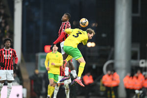 Daniel Kanu challenges in the air during Walsall's heavy defeat at Norwich.