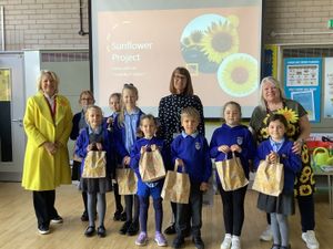 Supporting image for story: Pupils lend a hand as village prepares to get back on the In Bloom map