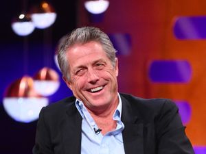 Supporting image for story: Hugh Grant on doing shots with Travis Kelce at Taylor Swift gig: We went crazy