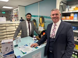 Councillor Anthony Screen with Director and Superintendent Pharmacist Amardeep Mann at Pyramid Pharmacy Stafford