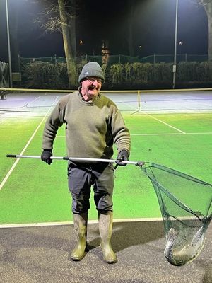 The groundsman at Shrewsbury Lawn Tennis Club rescued a fish during a flood event