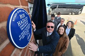 Prospect Coaches in Lye where a plaque was unveiled commemorating the late Ros Hadley. L-R: Ros's son Nathan Hadley, Laura Hadzik (national chair of Women in Bus and Coach), Karen Tiley (Midlands chair of Women in Bus and Coach), Nathan's wife Claire Hadley-King and the couple's sons Tom King and Jake Hadley, with the West Bromwich Albion first team coach to the rear