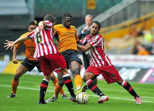 Sheffield United's Florent Cuvelier (left) and Ryan Hall (right) hold up Wolverhampton Wanderers' Bakary Sako