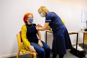 Gillian Jefferies, 75, from Muxton, getting her shot from Janet Holmes