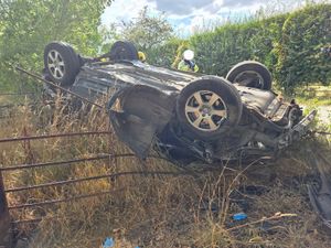 A car ended up on its roof after a crash near Mile End golf course, Oswestry. Photos: Ellesmere Fire Station