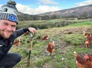 Dan Lydiate with his free-range chickens at Abbeycwmhir