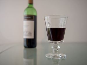 A wine bottle and a glass of wine