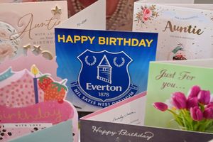 LAST COPYRIGHT NATIONAL WORLD PLC STEVE LEATH 08/05/24..Pic at Wheatlands Care Home, Much Wenlock, where Joan Harrison has just had her 101st birthday. The call went out to get 101 cards, but they have ended up with over 300 from all over, including from her beloved Everton FC. She is pictured on some with her Niece: Barbara McGarbey, and staff: Kneeling: Katie Mace and on setee: Stacey Walton and Abbie Field. Also copy pics of her in the services and as a young lady..