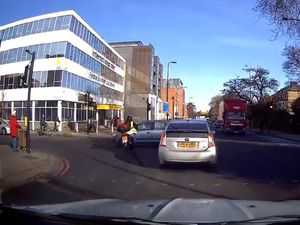 Supporting image for story: Biker hits car while riding through amber light – but who’s to blame?