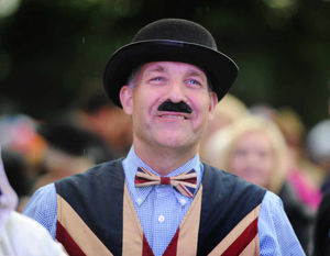 An audience member enjoys the Party in the Park