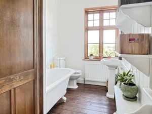 The family bathroom has been recently refitted by the current owners and keeps with the traditions of the cottage. Photo: Yopa