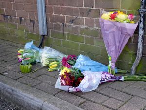 Floral tributes near the scene in Paradise Road, Clapham, south London, where a 16-year-old boy died after being shot