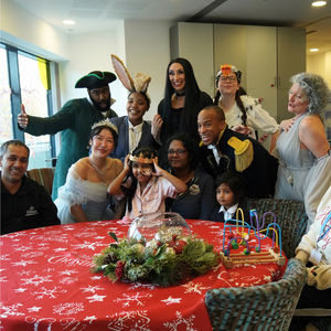 Cast of BOA Group's Cinderella pose with families at Ronald McDonald House Birmingham