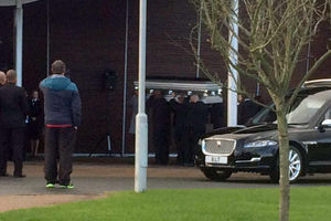 The coffin is carried inside