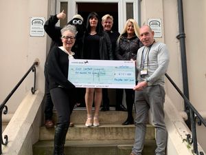 Members of Soul Division present the cheque to the Good Shepherd charity