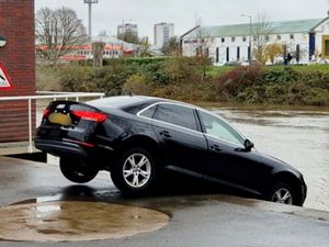 Supporting image for story: Moment Audi left dangling precariously over River Severn despite nearby warning sign