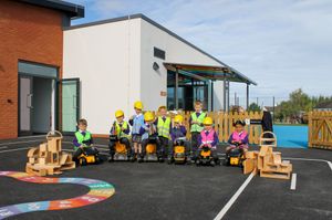 Allscott Meads Primary School children with their new mini diggers  