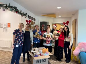 Supporting image for story: Cannock opticians spreads festive cheer with donation  to Acorns Children’s Hospice