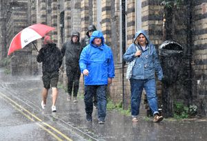 Visitors to the Bridgnorth Italian Moto Fest brave the horrendous downpours to view the cars on show