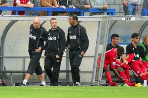 The Hednesford Town management team from left Chris Brindley, Rob Smith and Larry Chambers in the away dugout, all three have connections to AFC Telford United
