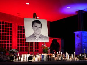 A photo of Charlie Kirk stands at his vigil