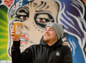 Green Duck beer director Alex Hill with a pint of Tiers for Beers