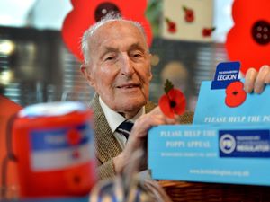 Supporting image for story: Poppy seller still setting out his stall and sharing message of humanity aged 103