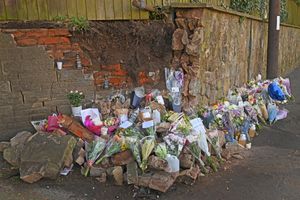 A growing pile of tributes has been left at the roadside