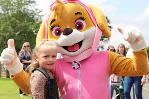One of the Paw Patrol mascots, Skye, poses in the sun with a new friend. Photo: Derwen College