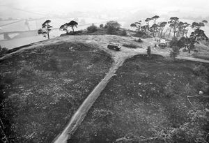 The top of Haughmond Hill after a major fire in the summer of 1976. The caption pasted on the back of this print reads 'Acres of devastation... the once famous beauty spot of Haughmond Hill reduced to smouldering and charred devastation as seen in this aerial picture.'  Firefighters fought this fire for days. The drought had caused tinderbox conditions. 