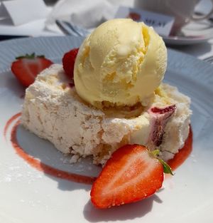 White Chocolate Roulade, vanilla ice cream with strawberries and raspberries  