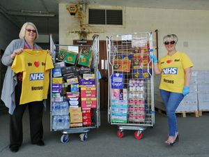 The first delivery of goodies arrive from the money raised from the T-shirts. Pictured receiving them, is catering manager Trish Purfitt, left, from john's wife Diane.