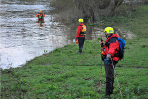 Members of West Midlands Search and Rescue searching the banks of the River Severn alongside Sydney Avenue in Shrewsbury