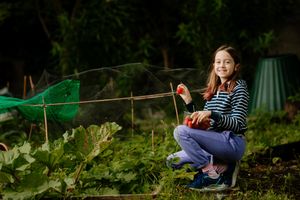 Young gardener Grace helping out at Cross Houses Allotments near Shrewsbury