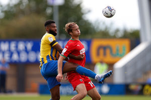 Ethan Ebanks-Landell of Shrewsbury Town and Aaron Pressley of AFC Wimbledon (AMA)