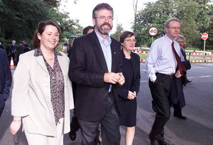 Sinn Fein president Gerry Adams (centre) and other members of the delegation smile as they arrives for the second day of intensive talks aimed at salvaging the Northern Ireland peace process at Weston Hall,