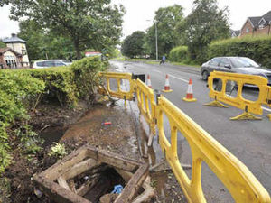 Supporting image for story: Water burst floods Telford road