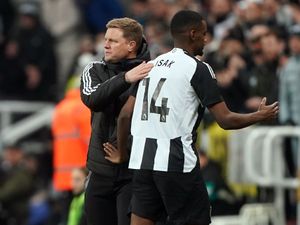 Newcastle striker Alexander Isak (right) is congratulated by head coach Eddie Howe after being substituted against Wolves